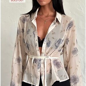 Motel Sheer Shirt in Wild Rose Blue, semi-sheer blue floral print waist ribbon.
